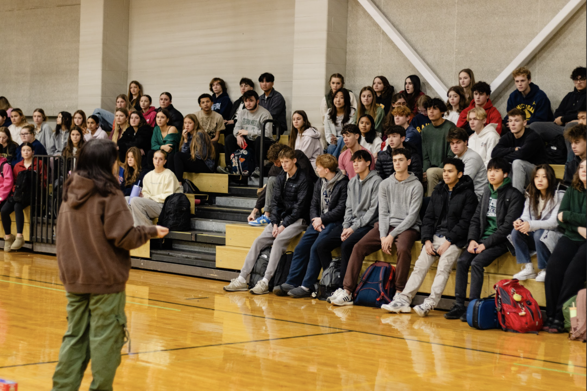 At the third quarter morning meeting on Wednesday, Jan. 15, National Honor Society Vice President senior Lilly Wall explains the teacher supply drive to members.
